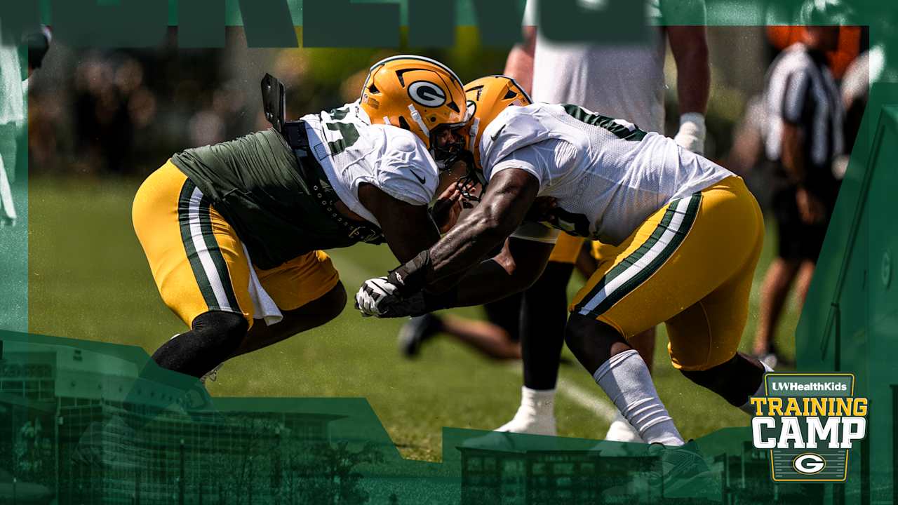 Two Packers linemen collide in a padded drill at training camp